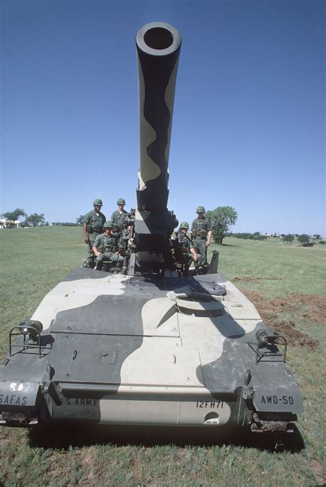 Crewmen Of An M110 203 Mm Self Propelled Howitzer Man Their Positions