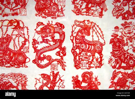 Examples of the ancient art of Chinese paper cutting on sale by the ...