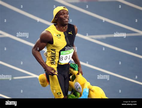 jamaica s usain bolt celebrates winning the men s 100m final at the olympics stadium on the