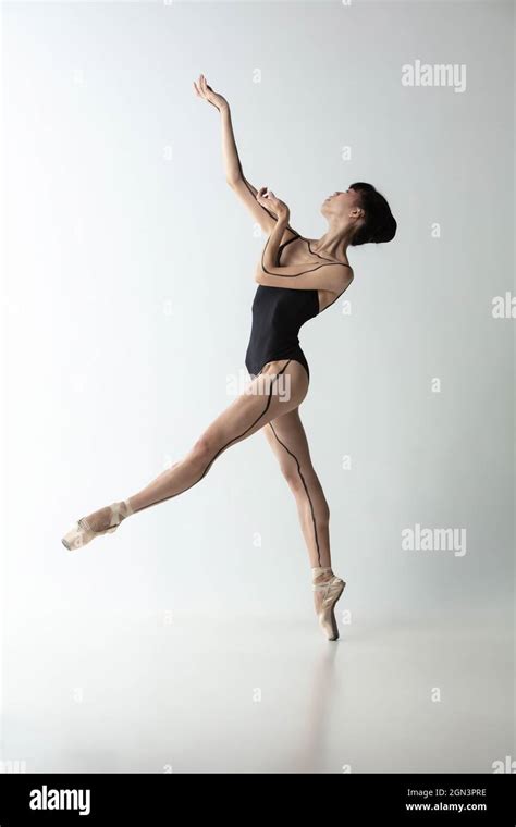 Japanese Female Ballet Dancer Ballerina Dancing Isolated On Light Gray