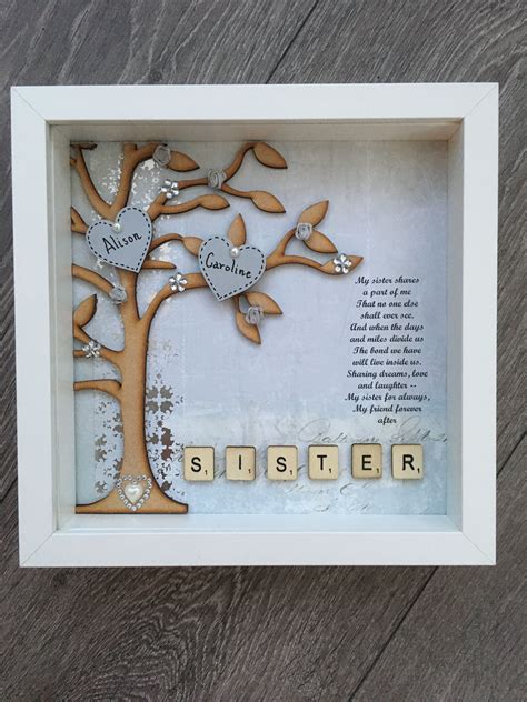 It comes attached to a card with a sweet sister quote that reads: Box frame gift for a sister. Perfect birthday present ...