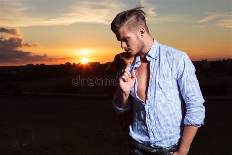 Casual Man Looks Down With Sunset Behind Stock Photo Image Of Pocket