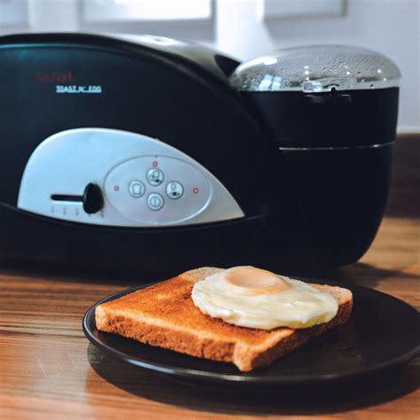 The tefal toaster with an egg cooker bolted on the side. Tefal TT550015 Toast n Egg 2 Slice Toaster with Egg Poacher
