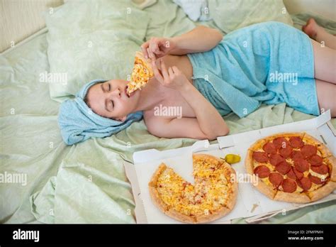 Cute Girl With A Towel On Her Head Eats Pizza In Bed Young Woman Eating Pizza In Bed Life Is A