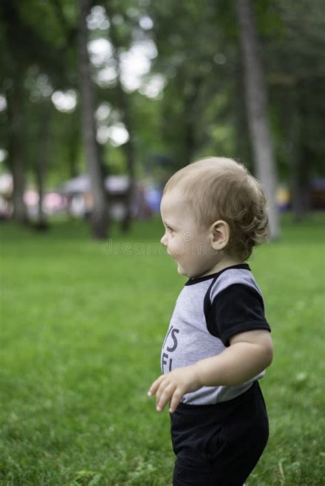 A Child Walks On The Grass Stock Image Image Of Childhood 157655143