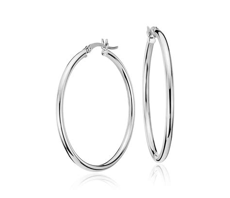 14k white gold earrings, cultured freshwater pearl (10mm) and diamond ( 1/10 ct.t.w) leverback earrings (also available in 14k yellow gold or pink cultured freshwater pearls in 14k rose gold) $1,000.00 Medium Hoop Earring in 14k White Gold (1 3/8") | Blue Nile