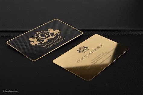 A Gold And Black Business Card Sitting On Top Of A Table Next To A Bag