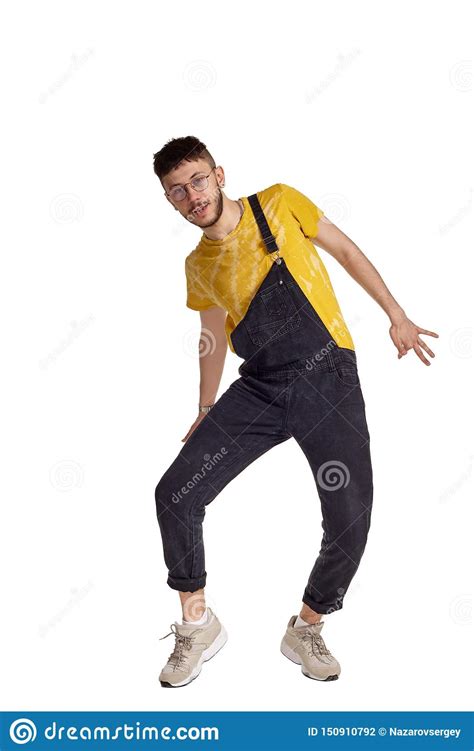 Full Length Portrait Of A Funny Guy Dancing In Studio Isolated On White