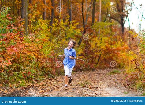 Kids Play In Autumn Park Children In Fall Forest Stock Photo Image