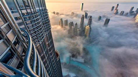 Aerial View Of Cityscape With Skyscrapers Above The Clouds In Dubai