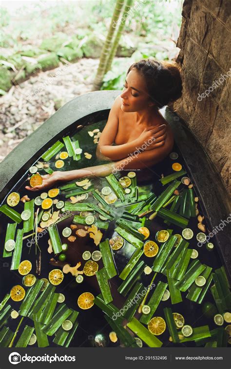 Beautiful Young Woman Enjoying In Outdoor Spa Luxury Stone Bath