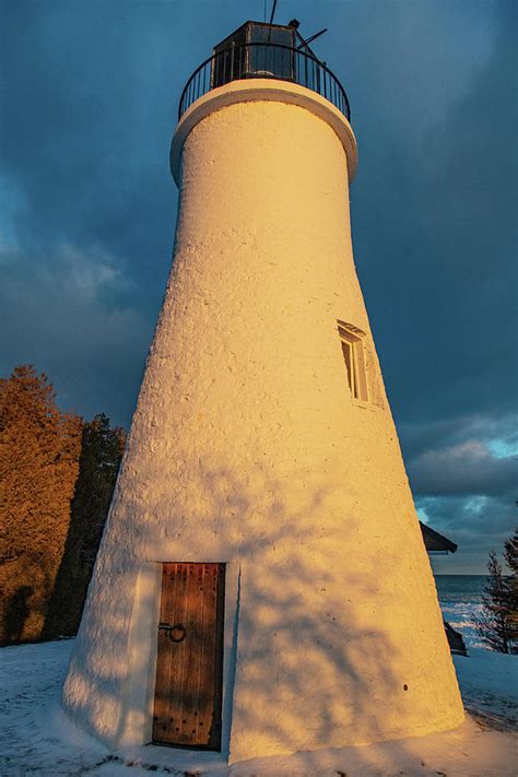 Old Presque Isle Lighthouse In Michigan Along Lake Huron In The Winter