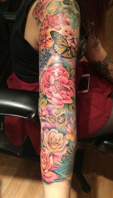 It is in all grey tone i then had a full sleeve added with roses and the quote, 'death leaves a heartache no one can this lotus flower represents someone who is able to thrive in every environment they are put in. The different flowers would represent my children and ...
