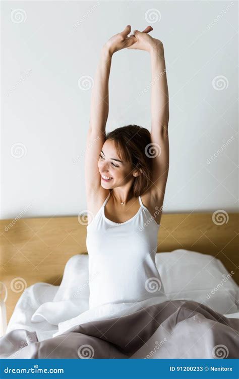 Beautiful Young Woman Stretching In Bed After Wake Up Stock Image