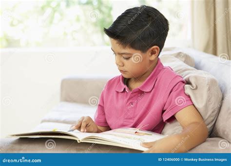 Young Boy Reading Book At Home Stock Photo Image Of Indoors Length