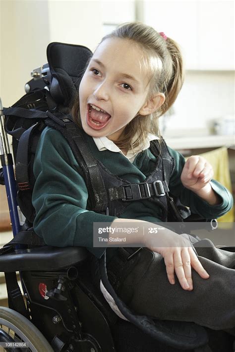A Disabled Girl In Her Wheelchair High Res Stock Photo
