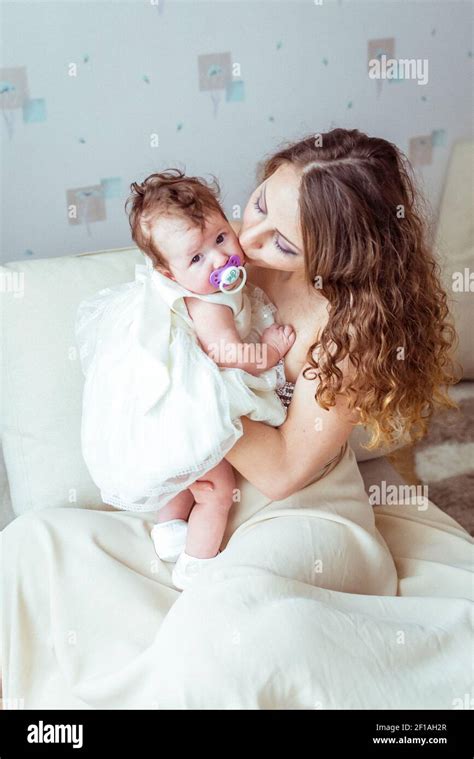 Mother Holding Baby In Her Arms Stock Photo Alamy