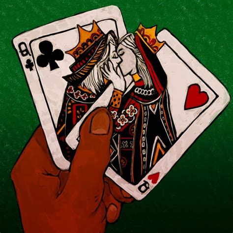 A Hand Holding Two Playing Cards In Front Of A Green Background With