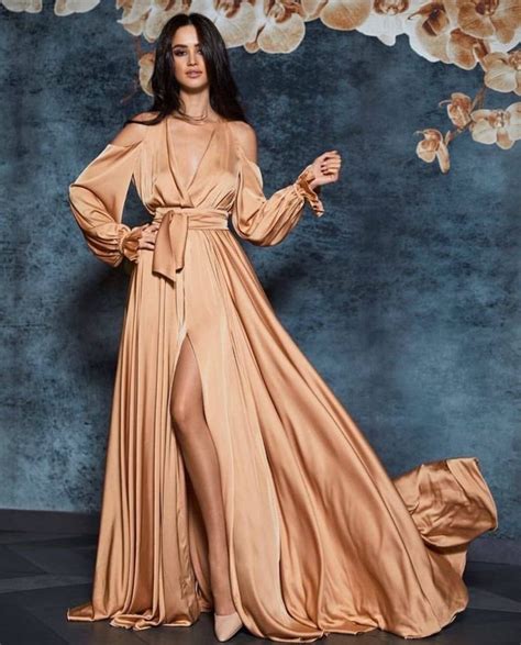 Long sleeve wedding dresses are demure and harken to a different era. Champagne silk A-line cold shoulder maxi wrap dress ...