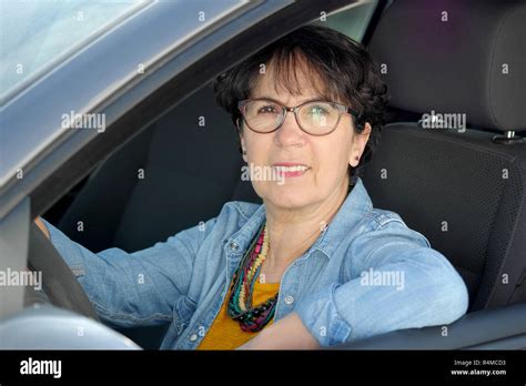 Brunette Mature Woman Driving Car Stock Photo Alamy