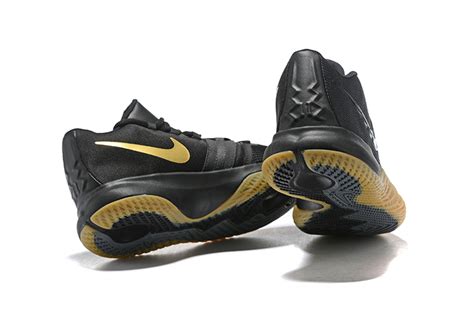 Dressed in a black, metallic gold and white color scheme. Men's Nike Kyrie Flytrap Black/Gum-Metallic Gold Free Shipping