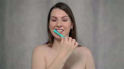Woman Naked Cleans Her Teeth With Toothbrush And Paste After Shower Stock Footage
