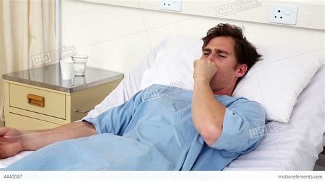 Sick Man Lying On Hospital Bed Coughing Stock Video Footage 4440087