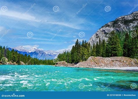 Bow River In Banff National Park With Canadian Rockies In Background