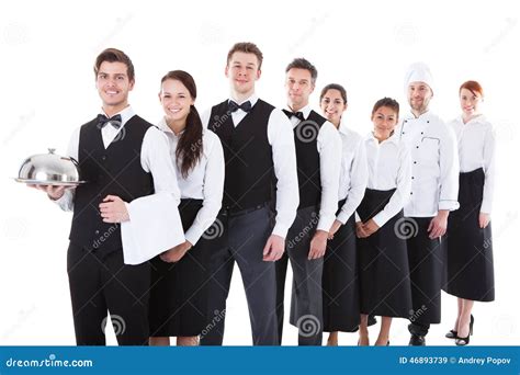 Large Group Of Waiters And Waitresses Standing In Row Stock Image