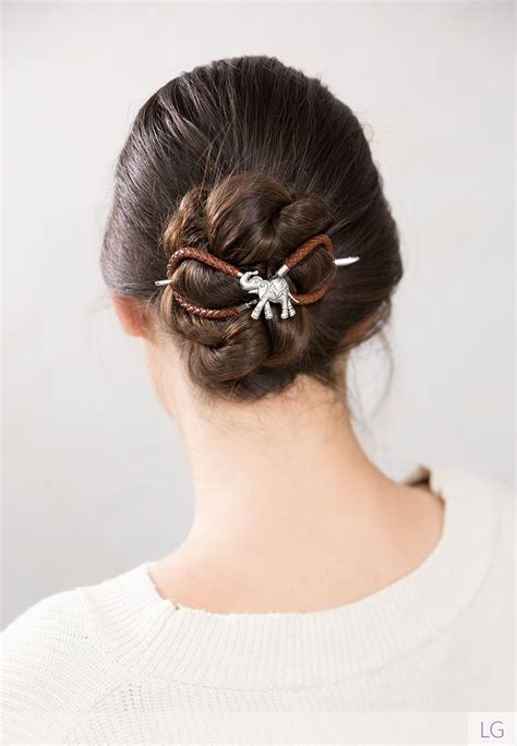 Fixing hairstyles with a bun. Beautiful low braided bun hairstyle with a super fun ...