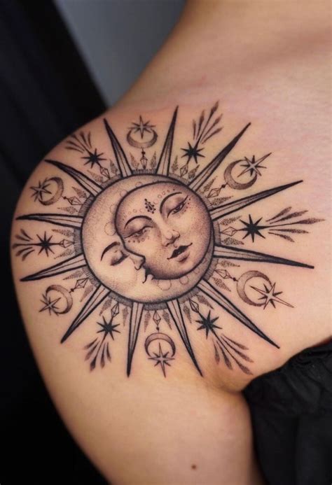 A Womans Stomach With A Sun And Moon Tattoo On The Back Of Her Shoulder
