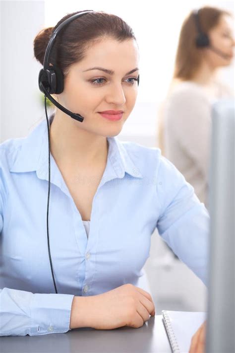 Call Center Operator In Headset Young Businesswoman Sitting At Desk