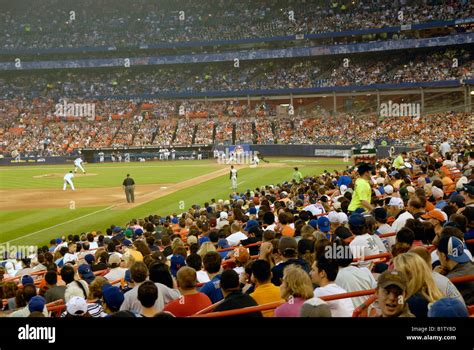 Crowd Of Fans Watching Baseball Game With The Mets Playing At The Shea