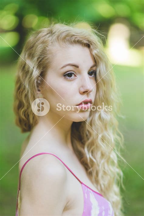 Portrait Of Young Beautiful Caucasian Blonde Hair Woman Outdoor In A