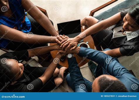 Top View Of South African Business Team With Hands Stacked Together In