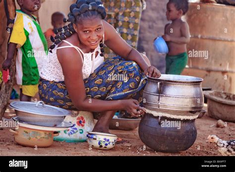 In Djibo In Northern Burkina Faso A Fulani Woman Seals Two Pots
