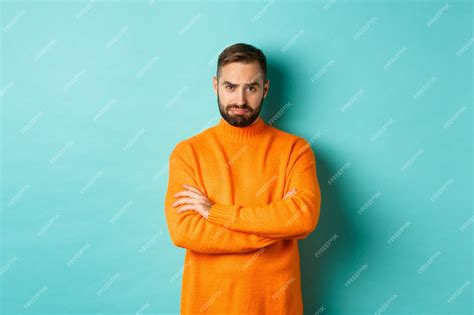 Premium Photo Silly Sad Guy With Beard Sulking And Looking Offended