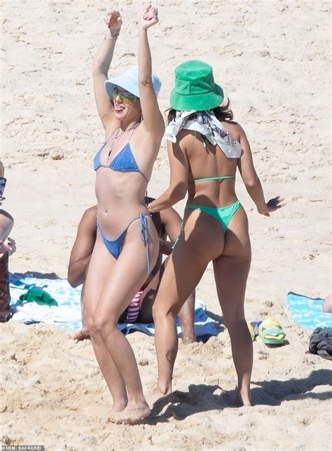 Vanessa Hudgens Flaunts Her Figure In Neon Green Thong Bikini And Hat At The Beach In Mexico