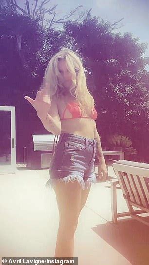 Avril Lavigne Is A Sk8er Girl In Red Cut Out Bikini Top As She Kisses