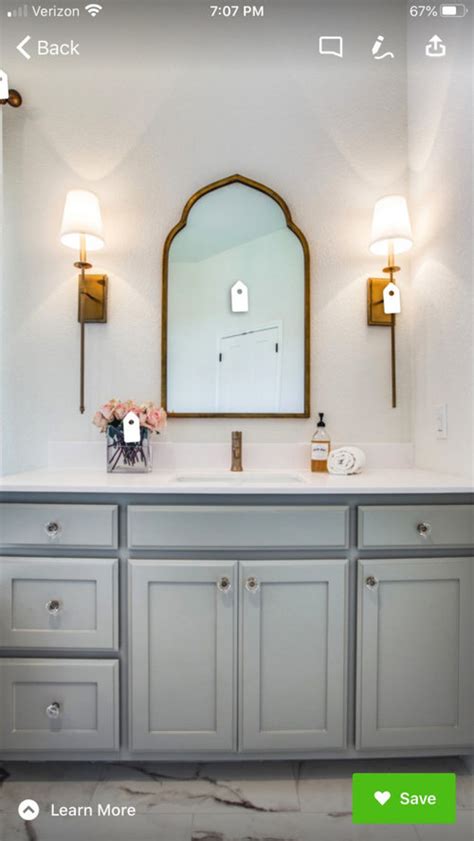 The bathroom, just like the kitchen, is one of the rooms in a house that needs a facelift every decade or so to keep up with the times. pulls, mirror, and lighting to match delta Champagne ...