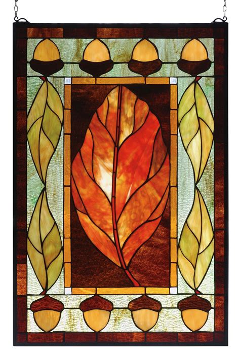 A Stained Glass Window With A Leaf On It