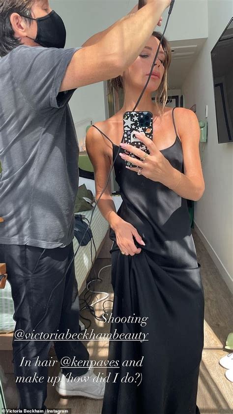 victoria beckham looks effortlessly chic in a black slip dress as she poses in the mirror