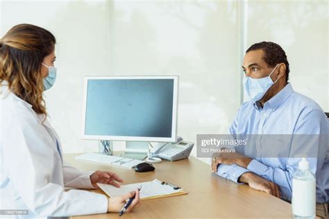 Female Doctor Asks Patient Questions High Res Stock Photo Getty Images