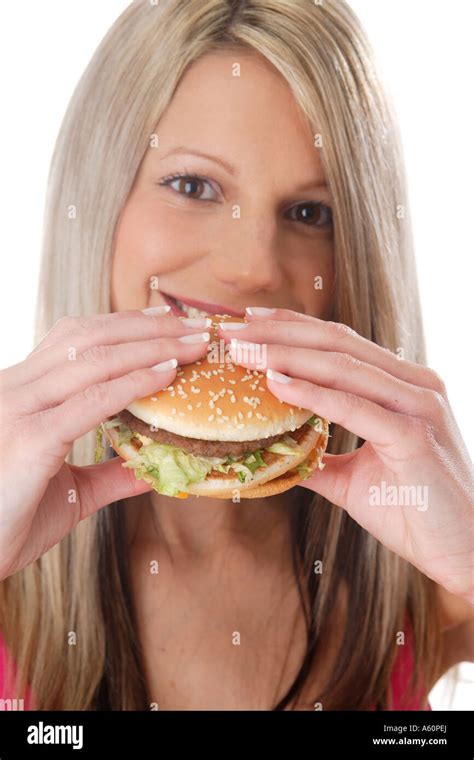 Woman Eating Hamburger Stock Photo Alamy