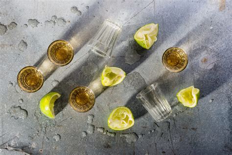 Tequila Shots With Limes By Stocksy Contributor Jeff Wasserman