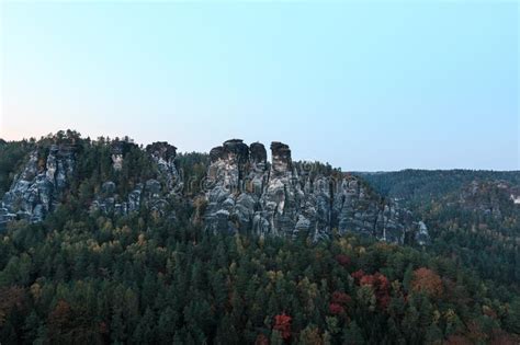 Rock Formation With Trees In The Autumn Of Elbe Sandstone Mountain In