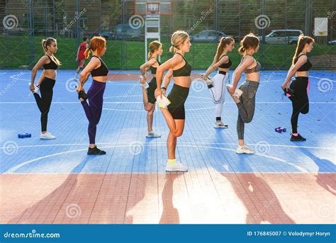 Group Of Young Sporty Women Are Practicing Yoga Lesson Standing In Vrksasana Exercise Girls Are