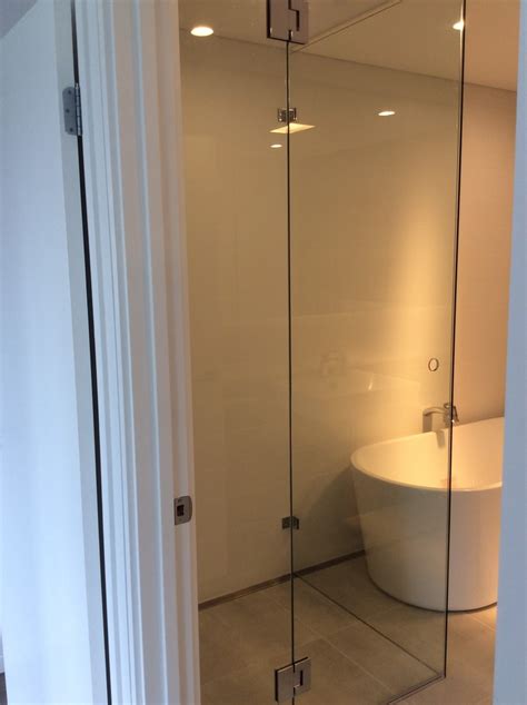 Frameless Corner Shower Screen With Polished Finger Pull Contemporary