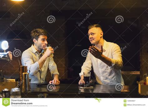 Two Happy Young Men Talking And Drinking Beer At Bar Stock Image Image Of Glass Football