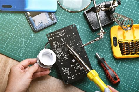 Electronics Repair Service Technician Fixing Electronic Circuit Board